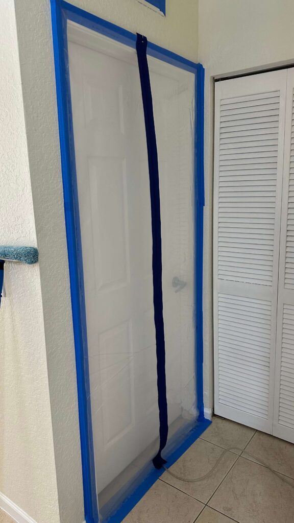 Professional Mold Remediation in West Palm Beach, FL 7 Covered the door with plastic & blue tape